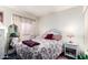 Bedroom featuring a bed with floral bedding, side table and lamp at 1943 E San Tan St, Chandler, AZ 85225