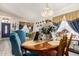 Charming dining room with a wooden table, upholstered chairs, and decorative accents at 1943 E San Tan St, Chandler, AZ 85225
