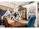 Elegant dining room with a wooden table, upholstered chairs, and a decorative china cabinet at 1943 E San Tan St, Chandler, AZ 85225