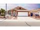 Cozy single-story home with a well-kept front yard, desert landscaping, and a two-car garage at 1943 E San Tan St, Chandler, AZ 85225