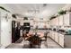 Eat-in kitchen featuring a round table, black appliances and light tone cabinets at 1943 E San Tan St, Chandler, AZ 85225