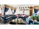 Inviting living room with blue sofas, a glass coffee table, and decorative wall hangings at 1943 E San Tan St, Chandler, AZ 85225