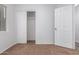 Bedroom featuring carpet, white walls, and a closet at 1952 N 103Rd Dr, Avondale, AZ 85392