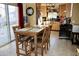 Dining area featuring wood table and chairs, tile flooring and view into kitchen at 2014 N 17Th Pl, Phoenix, AZ 85006