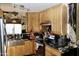 Well-appointed kitchen with stainless steel appliances, butcher block countertops, and light wood cabinets at 2014 N 17Th Pl, Phoenix, AZ 85006