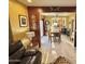 Open floor plan featuring tile flooring, dark wood accents, and views into the dining and kitchen at 2014 N 17Th Pl, Phoenix, AZ 85006