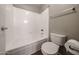 Neat bathroom featuring a shower-tub combo, toilet, and towel rack for convenience and functionality at 2025 E Campbell Ave # 137, Phoenix, AZ 85016