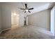 Spacious bedroom with closet, ceiling fan, and access to the hallway, offering comfortable living at 2025 E Campbell Ave # 137, Phoenix, AZ 85016