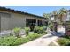 Exterior of community building with walkway, garden and palm trees at 2025 E Campbell Ave # 137, Phoenix, AZ 85016