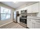 Bright kitchen with stainless steel appliances, and bright window at 2025 E Campbell Ave # 137, Phoenix, AZ 85016