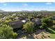 Picturesque aerial view of a residential neighborhood with houses, mature trees, and lush landscaping at 21105 N 37Th Run, Phoenix, AZ 85050