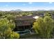 Aerial shot showcasing a lovely home, pool, landscaped backyard, and surrounding neighborhood in a picturesque setting at 21105 N 37Th Run, Phoenix, AZ 85050