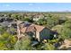Expansive aerial view of backyard oasis including pool, playground, mountain views, and lush trees at 21105 N 37Th Run, Phoenix, AZ 85050