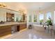 Luxurious bathroom with a soaking tub, dual vanities, and designer fixtures at 21105 N 37Th Run, Phoenix, AZ 85050