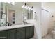 Elegant bathroom with double sinks, modern fixtures, and a clean, stylish design at 21105 N 37Th Run, Phoenix, AZ 85050