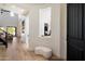 Bright entryway with hardwood floors, high ceilings, and a view into the living room at 21105 N 37Th Run, Phoenix, AZ 85050