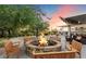 Inviting community fire pit with seating, creating a warm and social gathering space for residents at 21105 N 37Th Run, Phoenix, AZ 85050
