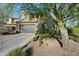 Charming two-story home with a desert landscape, attached two car garage, and elegant architectural details at 21105 N 37Th Run, Phoenix, AZ 85050