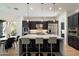 Sleek kitchen with stainless steel appliances, a large island, and modern pendant lighting at 21105 N 37Th Run, Phoenix, AZ 85050