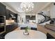 Open-concept kitchen offers stainless appliances, dark cabinetry, light counters, and a connected breakfast nook at 21105 N 37Th Run, Phoenix, AZ 85050