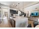 Open concept kitchen features a large island with bar seating and sight lines to the living area at 21105 N 37Th Run, Phoenix, AZ 85050