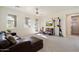 A versatile living area with a comfy leather couch and a gym area with weights at 21105 N 37Th Run, Phoenix, AZ 85050