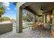 Relaxing covered patio with view of the pool and grassy area, perfect for outdoor dining and entertaining at 21105 N 37Th Run, Phoenix, AZ 85050
