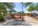 Community playground with slides, climbing structures, and covered picnic areas, perfect for Gathering fun at 21105 N 37Th Run, Phoenix, AZ 85050