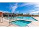 Sparkling pool and hot tub area with meticulously designed tiling and landscaping, perfect for relaxation at 21105 N 37Th Run, Phoenix, AZ 85050