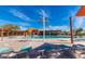 Inviting community pool area with lounge chairs, umbrellas, and a pristine pool for leisure and recreation at 21105 N 37Th Run, Phoenix, AZ 85050