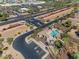 Aerial view of community pool and hot tub, adjacent to shopping, demonstrating accessibility and amenities at 2129 E Beautiful Ln, Phoenix, AZ 85042