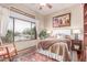 Cozy bedroom showcases a window view, plush bedding, and warm, inviting decor at 2129 E Beautiful Ln, Phoenix, AZ 85042