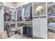 Walk-in closet offering ample storage with shelves, drawers, and hanging space for clothes and accessories at 2129 E Beautiful Ln, Phoenix, AZ 85042