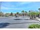 Gated community entrance with palm trees and manicured landscaping at 2129 E Beautiful Ln, Phoenix, AZ 85042