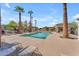 Inviting community pool with lounge chairs and shaded areas, perfect for relaxation and social gatherings at 2129 E Beautiful Ln, Phoenix, AZ 85042
