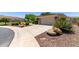 Attractive single-story home with a well-maintained yard, two-car garage, and desert landscaping at 2129 E Beautiful Ln, Phoenix, AZ 85042
