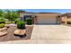 Charming single-story home with a neutral color scheme, stone accents, and a two-car garage at 2129 E Beautiful Ln, Phoenix, AZ 85042