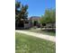 Charming single-story home featuring a well-manicured lawn and mature shade trees in a desirable neighborhood at 2129 E Beautiful Ln, Phoenix, AZ 85042