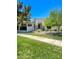 Charming single-story home featuring a well-maintained lawn and mature trees providing ample shade at 2129 E Beautiful Ln, Phoenix, AZ 85042