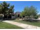 Charming single-story home featuring a well-manicured lawn and mature shade trees in a desirable neighborhood at 2129 E Beautiful Ln, Phoenix, AZ 85042