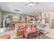 Spacious living area showcasing tile floors, a dining area, and a glimpse of the kitchen at 2129 E Beautiful Ln, Phoenix, AZ 85042