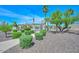 Lush landscaping surrounds the community pool area with mature trees, a relaxing walkway, and manicured bushes at 2129 E Beautiful Ln, Phoenix, AZ 85042