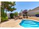 Inviting backyard pool area with mature landscaping and stone accents at 2129 E Beautiful Ln, Phoenix, AZ 85042