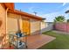 Backyard featuring a deck, synthetic grass, and privacy fence at 2234 N 74Th Way, Scottsdale, AZ 85257