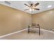 A warm and inviting bedroom with laminate floors, desk, and ceiling fan at 2234 N 74Th Way, Scottsdale, AZ 85257
