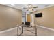A warm and inviting bedroom with laminate floors, closet, desk, and ceiling fan at 2234 N 74Th Way, Scottsdale, AZ 85257