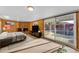 Bedroom with wood paneled walls, fireplace, sliding glass door to patio and swimming pool at 2234 N 74Th Way, Scottsdale, AZ 85257