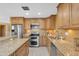 Kitchen with granite countertops, stainless steel appliances, and updated cabinetry at 2234 N 74Th Way, Scottsdale, AZ 85257