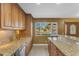 Kitchen with granite countertops, stainless steel appliances, and updated cabinetry at 2234 N 74Th Way, Scottsdale, AZ 85257