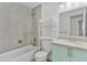 Renovated bathroom featuring tiled shower/tub and sink with granite countertop at 2706 W Isabella Ave, Mesa, AZ 85202